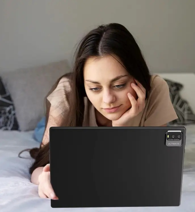 A woman lying on a bed, reading on a ZZB 10-inch Android tablet